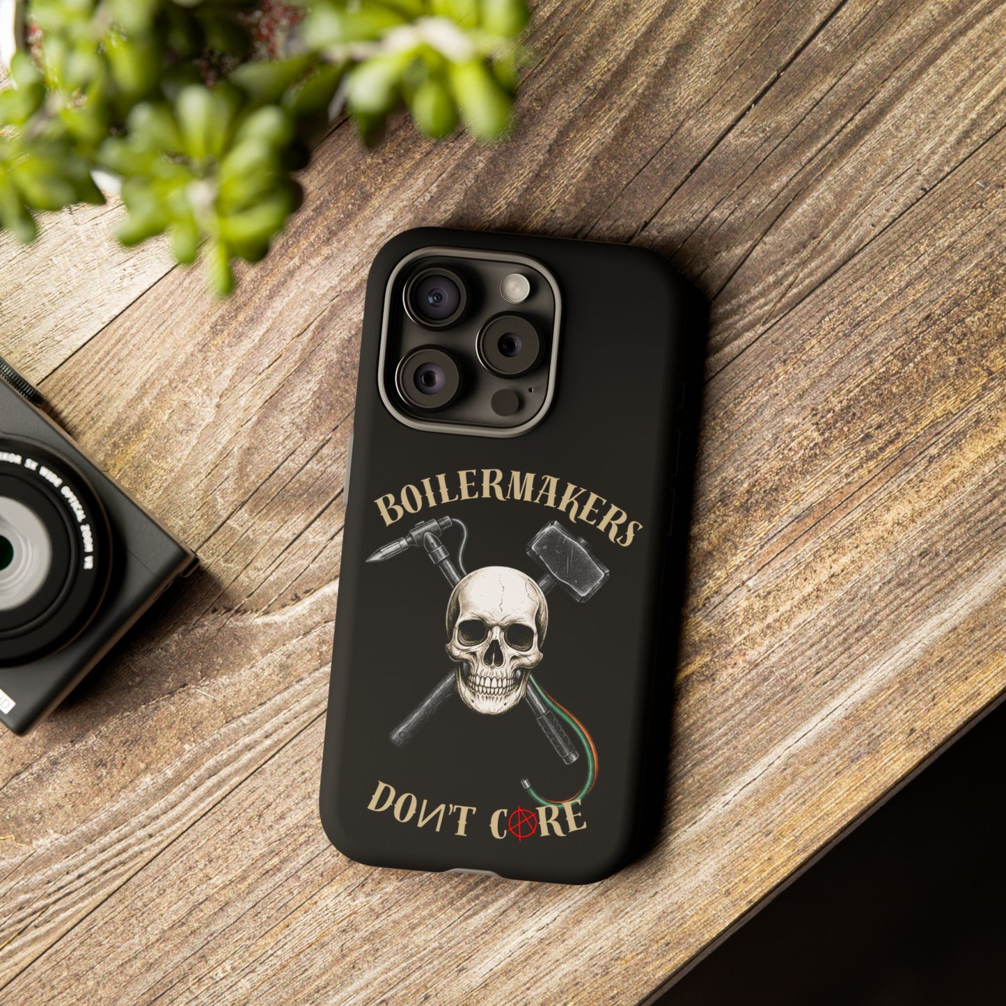 Boilermakers Don’t Care Tough Case — skull-and-hammer design, full-wrap protection built for the hard hands who keep the world running.