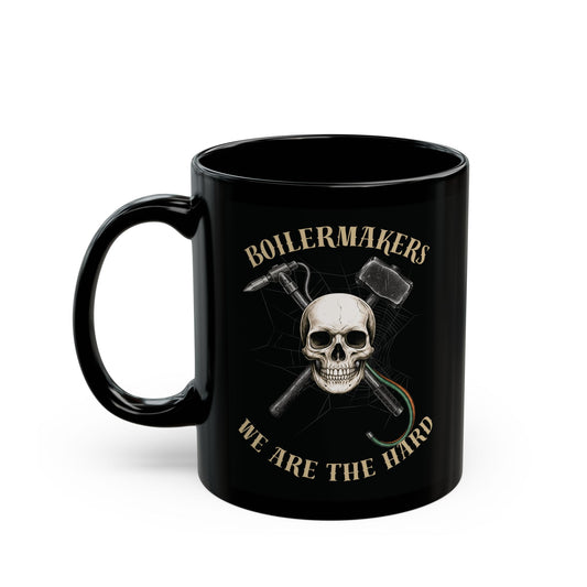 Boilermakers “We Are the Hard” Skull Mug — black ceramic, bold gold print, built for those who wake up ready to burn hotter and work harder.